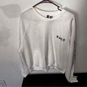 H&M divided tour of Japan crop length sweatshirt